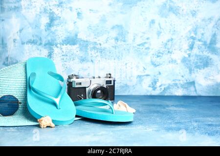 Set of beach accessories on color background Stock Photo