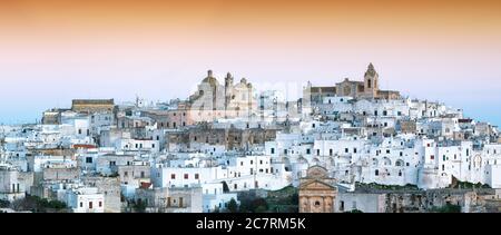 Ostuni white town skyline at sunrise. Brindisi, Apulia southern Italy. Europe. Stock Photo