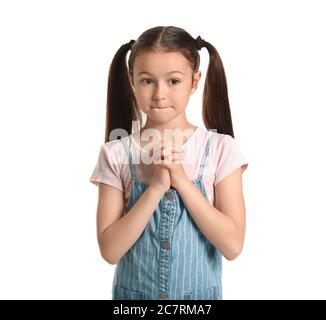 Apologizing little girl on white background Stock Photo - Alamy