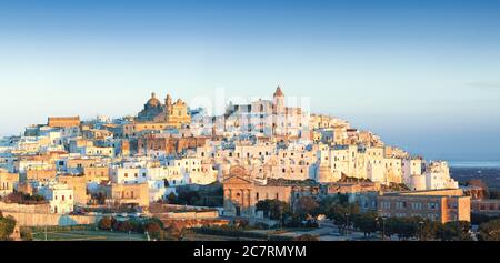 Ostuni white town skyline at sunrise. Brindisi, Apulia southern Italy. Europe. Stock Photo