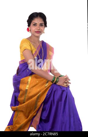 Image of Beautiful Indian young girl posing in traditional Indian saree on  white background.-OU653701-Picxy