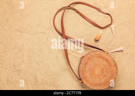 Stylish female bag on sand background Stock Photo