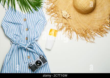 Summer composition with female clothes on light background Stock Photo