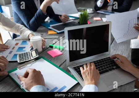 Business corporate management planning team concept, people sitting around office table and working with financial data reports Stock Photo