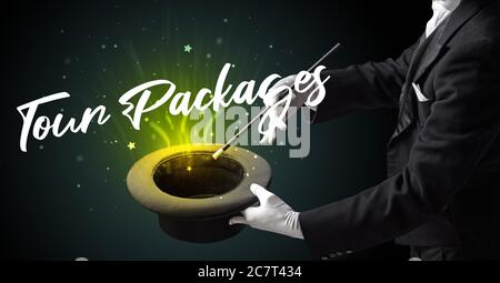 Magician is showing magic trick with Tour Packages inscription, traveling concept Stock Photo