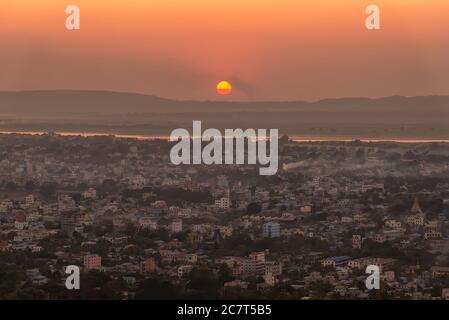 Sunset over Irrawaddy river and Mandalay city, Myanmar. Mandalay is the second-largest city in Myanmar, after Yangon Stock Photo