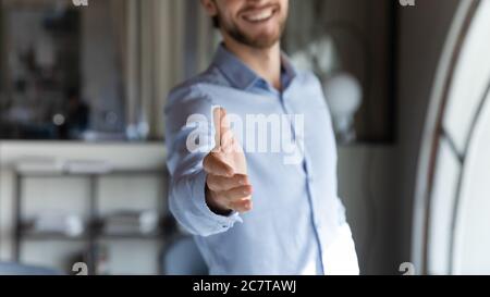 Close up of employer stretch hand greeting with new worker Stock Photo