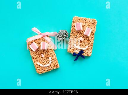 Composition with crispy rice bars on color background Stock Photo