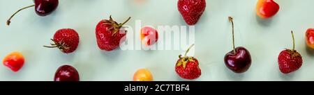 Colorful bright pattern with ripe cherry and strawberries. fresh summer berries. berry seamless pattern, strawberry and colorful cherries on pastel Stock Photo
