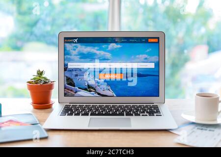 Open page of online booking service on screen of laptop on table Stock Photo