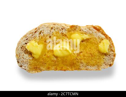 Studio shot of hot buttered toast cut out against a white background - John Gollop Stock Photo