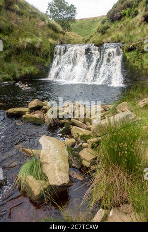 Alport Dale is a remove valley in the Peak District National Park with mant waterfalls and the famous Alport Castles, a major landslip Stock Photo