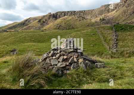 Alport Dale is a remove valley in the Peak District National Park with mant waterfalls and the famous Alport Castles, a major landslip Stock Photo