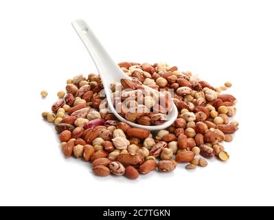 Spoon with raw legumes on white background Stock Photo