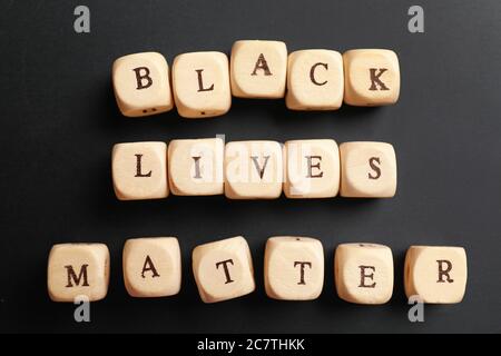 Cubes with text BLACK LIVES MATTER on dark background Stock Photo