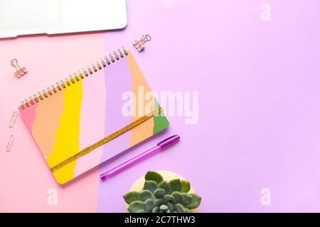 Composition with notebook on color background Stock Photo