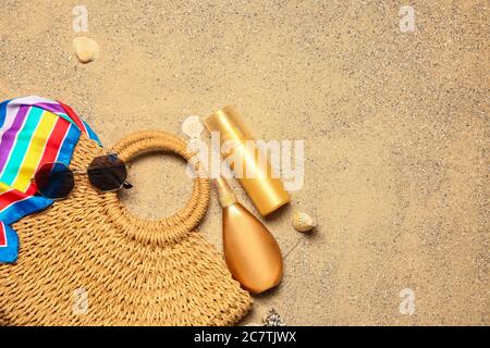 Set of beach accessories on sand, top view Stock Photo