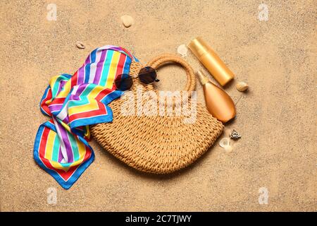 Set of beach accessories on sand, top view Stock Photo