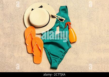 Set of beach accessories on sand, top view Stock Photo
