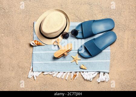 Set of beach accessories on sand, top view Stock Photo