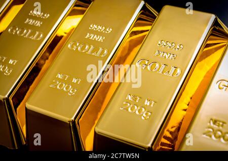 National reserve of gold, financial stability and commodity trading concept with many pure solid gold bars in a raw on black background with copy spac Stock Photo