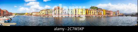 Panoramic cityscape of Bosa town on Temo river. River embankment with typical colorful Italian houses. Location:  Bosa town, Province of Oristano, Ita Stock Photo