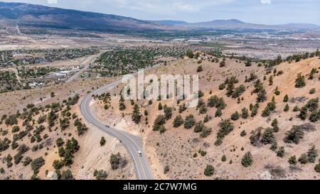 Drone photo over traffic going up mountain roads on Geiger grade near Virginia City Stock Photo