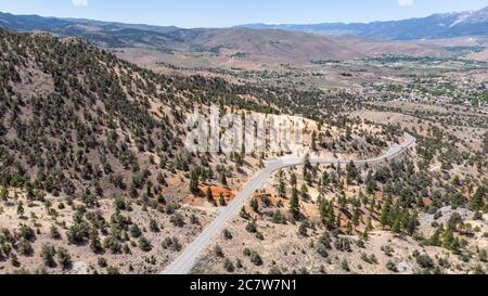 Drone photo over traffic going up mountain roads on Geiger grade near Virginia City Stock Photo