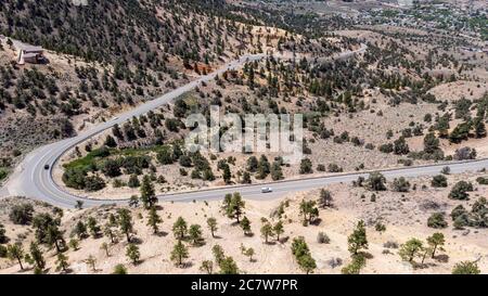 Drone photo over traffic going up mountain roads on Geiger grade near Virginia City Stock Photo