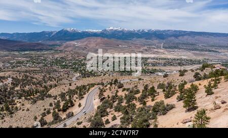 Drone photo over traffic going up mountain roads on Geiger grade near Virginia City Stock Photo