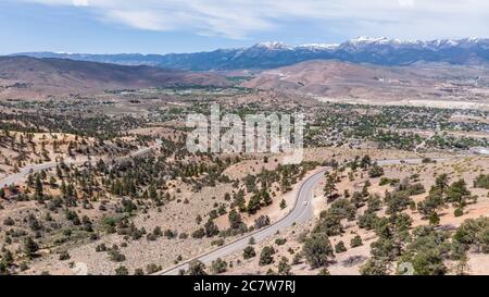 Drone photo over traffic going up mountain roads on Geiger grade near Virginia City Stock Photo