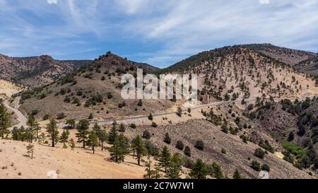 Drone photo over traffic going up mountain roads on Geiger grade near Virginia City Stock Photo