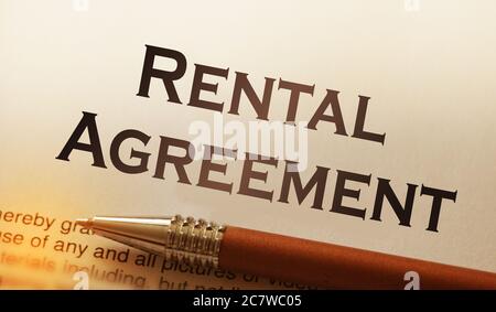 rental agreement form on desktop in business office showing real estate concept Stock Photo