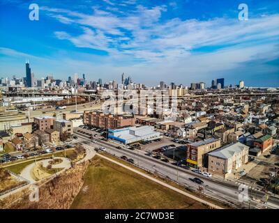 Aerial view above chicago, Illinois. With primary concentration on southside neighborhoods with historic skyline in the distance. Stock Photo