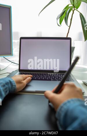 woman drawing on graphic tablet. working at home Stock Photo