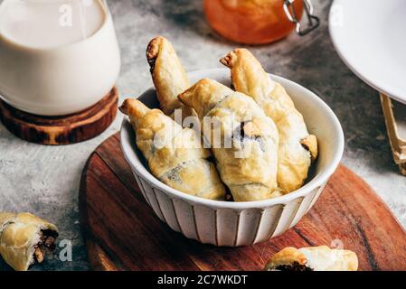 Croissants stuffed with nuts and chocolate spread Stock Photo