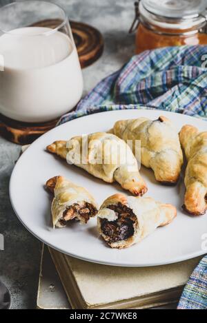 Croissants stuffed with nuts and chocolate for breakfast Stock Photo