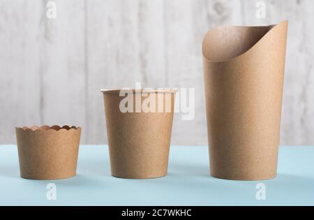 Disposable cups and baking cup on light background. Recycling concept.  Stock Photo