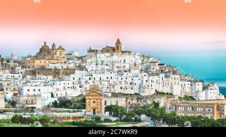 Ostuni white town skyline at sunrise. Brindisi, Apulia southern Italy. Europe. Stock Photo