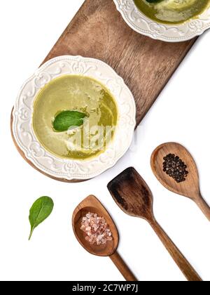 Plate of asparagus soup in knolling concept on white background. Stock Photo