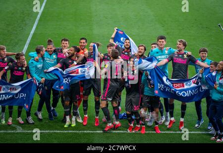 Derby, UK. 19th July, 2020. Leeds United players celebrate during the Sky Bet Championship match between Derby County and Leeds United at the Ipro Stadium, Derby, England. Football Stadiums around remain empty due to the Covid-19 Pandemic as Government social distancing laws prohibit supporters inside venues resulting in all fixtures being played behind closed doors until further notice on 19 July 2020. Photo by Andy Rowland. Credit: PRiME Media Images/Alamy Live News Stock Photo