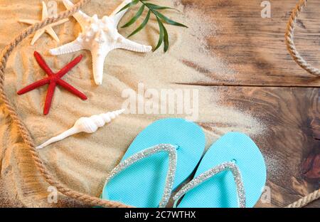 Summer background with seashells and slippers Stock Photo
