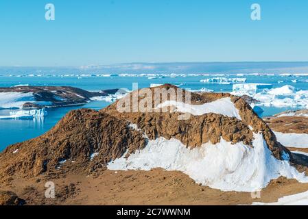 the harsh nature and landscapes of Antarctica. The ocean, icebergs and cold land. Stock Photo