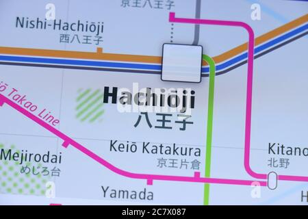 Hachioji station on Tokyo subway map on smartphone screen. Stock Photo