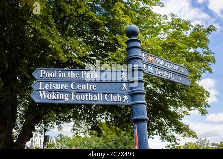 Signpost in Woking Park pointing to local attractions, places of interst, amenities and features in Woking, Surrey, southeast England Stock Photo