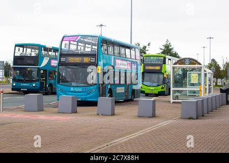 8 july 2020 Airport transfer coaches parked up outside the Liverpool John Lennon Airport Terminal building on a quiet afternoon during the Corona Viru Stock Photo