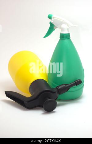 Vertical shot of yellow and green gardening tools on an isolated background Stock Photo