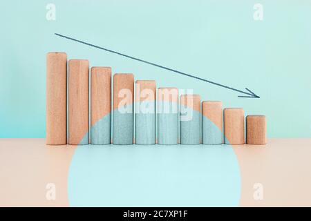 Wood block down graph with straight arrow, Risk management business financial and managing concept Stock Photo
