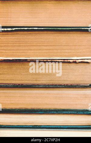 Stack of old used books background. Pile of vintage old hardback books. Back to school. Stock Photo