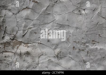 Texture-old gray plaster with cracks close-up. Stock Photo